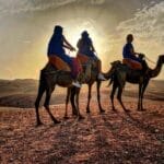 Camel ride in Agafay Desert at sunset