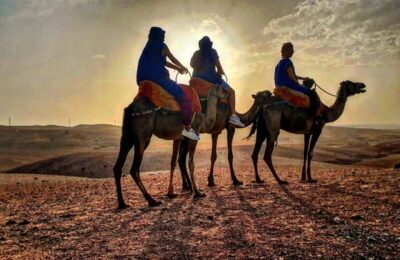 Camel ride in Agafay Desert at sunset