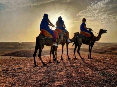 Camel ride in Agafay Desert at sunset