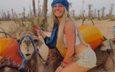 Evening camel ride with lanterns illuminating the path in Marrakech's Palmeraie.